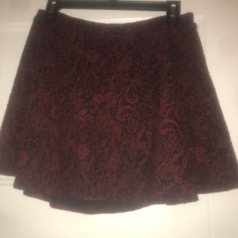 Maroon and black mini, slightly flared, skirt!
